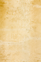 Vertical rustic gold stucco texture wall background