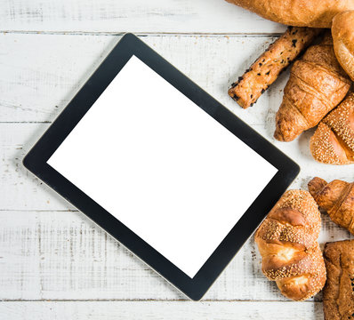 Bakery With  Tablet On Wood White Background