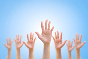 Many people blur hands raising up upward on white background showing vote, volunteering, participation concept/ campaign
