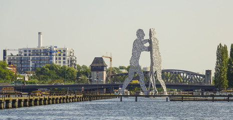 Molecule Men statue on River Spree in Berlin