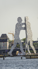 Molecule Men statue on River Spree in Berlin