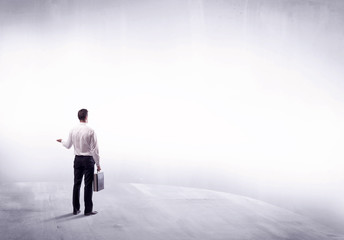 Business person standing from rear view