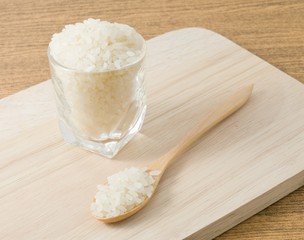 Japanese Rice in Wooden Spoon and Glass Cup