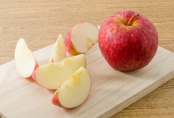Fresh Ripe Red Apple on A Wooden Tray