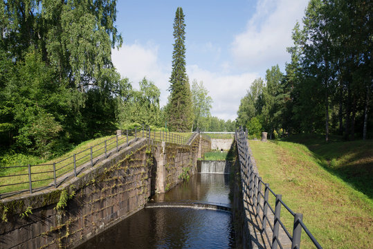 Remains of the old gateway "Mustola" on the Saimaa canal on a summer day. Finland