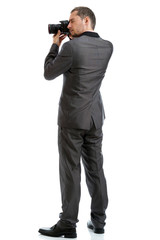 Full length suit tie photographer with camera