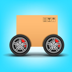 Fototapeta na wymiar cardboard box on wheels