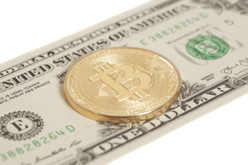 Golden  bitcoin coin and one dollar banknote
