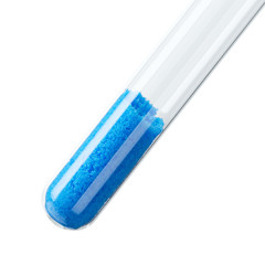 Cupric sulfate in test tube over white. Bright blue copper sulfate CuSO4, also blue vitriol or...