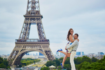 Romantic loving couple having a date near the Eiffel tower