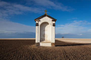 A small chapel on the empty  field