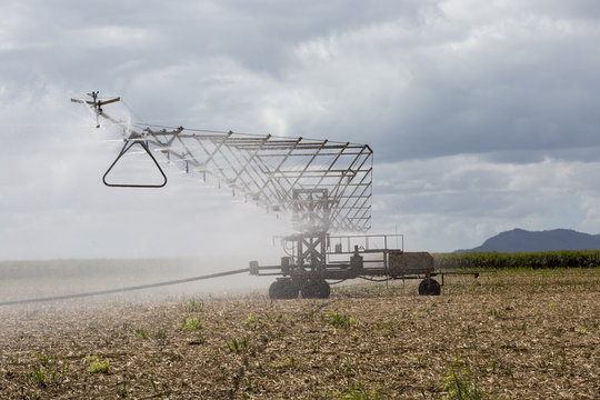 Side view of an overhead spray irrigator on sugar cane stubble paddock, Atherton Tableland, North Queensland.