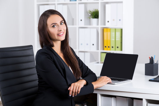 Smiling lady with long hair in office