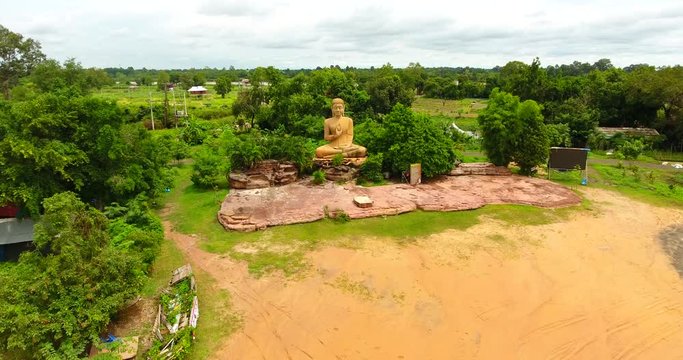 drone shot of Unseen golden Buddha in the forest