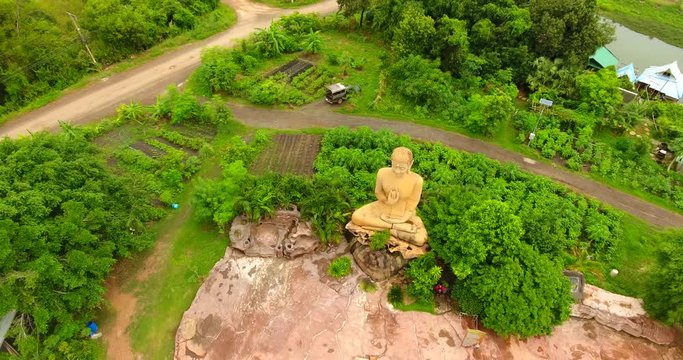 drone shot of Unseen golden Buddha in the forest