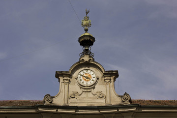 Fototapeta na wymiar Internal couryard of Palazzo Litta in Milan, view of the tower clock