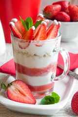 Beautifully arranged red and white yoghurt and strawberry dessert