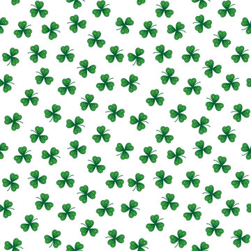 Cute funny seamless background pattern with stylized green clover leaves isolated on the white fond. Vector illustration eps 10