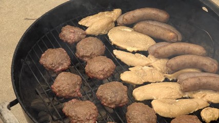 Flipping Hamburgers on a Charcoal Grill, 4K 100MBPS