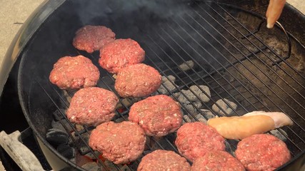 Flipping Hamburgers on a Charcoal Grill, 4K 100MBPS