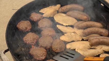 Flipping Hamburgers on a Charcoal Grill, 4K 100MBPS