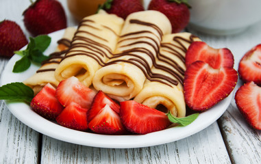 crepes with strawberries and chocolate sauce