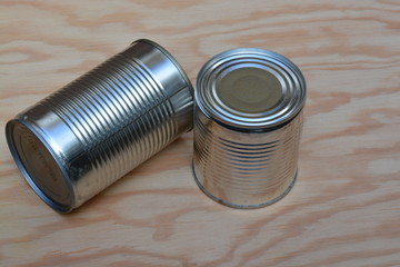 Tin cans on a wooden table