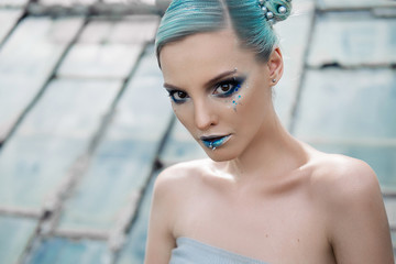 beautiful girl with blue make-up and hair