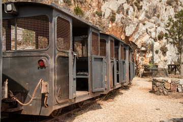 Old mine carts  in the Planu Sartu mine tunnel Galleria Henry near the mining village of Buggerru,...