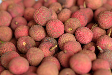 Pile of ripe lychees at the market
