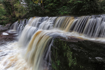 Fototapeta na wymiar Panwar, or Sgwd y Pannwr waterfall on the Mellte river, near Pontneddfechan in South Wales, UK.