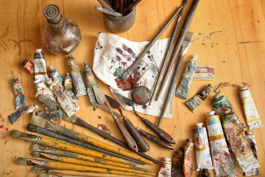 scattered on the table tools of the painter