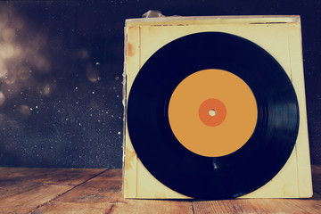 close up of old records on wooden table
