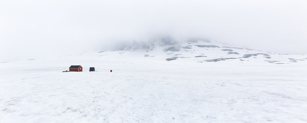 Winter view on mountain range, white cloud. Norway.