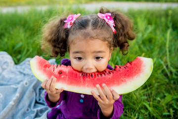 happy child eating watermelon