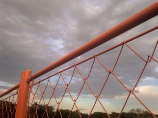 orange color fences and sky
