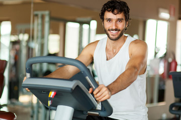 Man working out on a treadmill in a gym