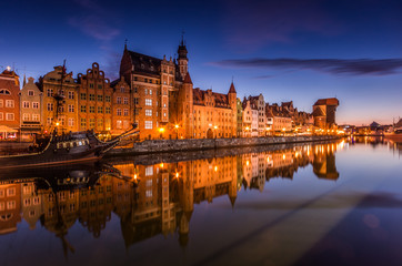 Gdansk old town with harbor and medieval crane in the night