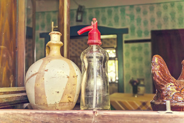 Vintage soda bottle and clay pitcher