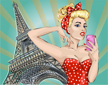 Pin-up sexy woman takes pictures on camera near Eiffel Tower in Paris.