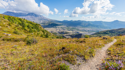 Amazing views of the volcano. White clouds are hovering over the mountains. Loowit Viewpoint, Mount St Helens National Park, West Part, South Cascades in Washington State, USA