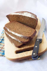 Loaf of wholegrain bread cut on slices