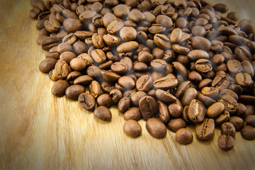 Coffee beans on vintage wooden board
