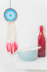 Blue dream catcher with red feathers