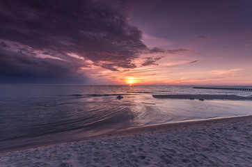 Fototapeta na wymiar Baltic sea beach on colorful sunset, Poland