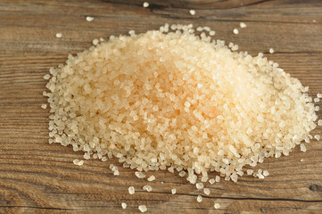 Bath salt isolated against a wooden background