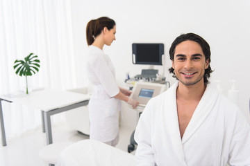 Obraz premium Joyful guy caring of his skin