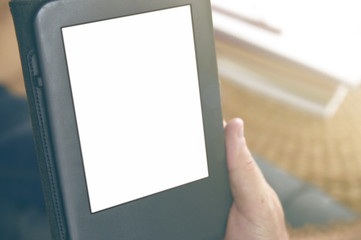 A man holding an ebook reading some documents. Empty copy space for Editor's text.