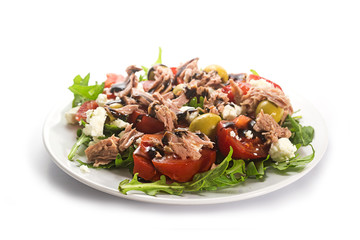 tuna salad with tomatoes, olives and arugula, recipe in a Mediterranean style on a white background