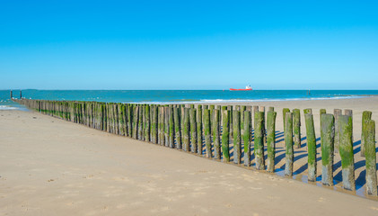 Fototapeta premium Breakwater to sea in summer